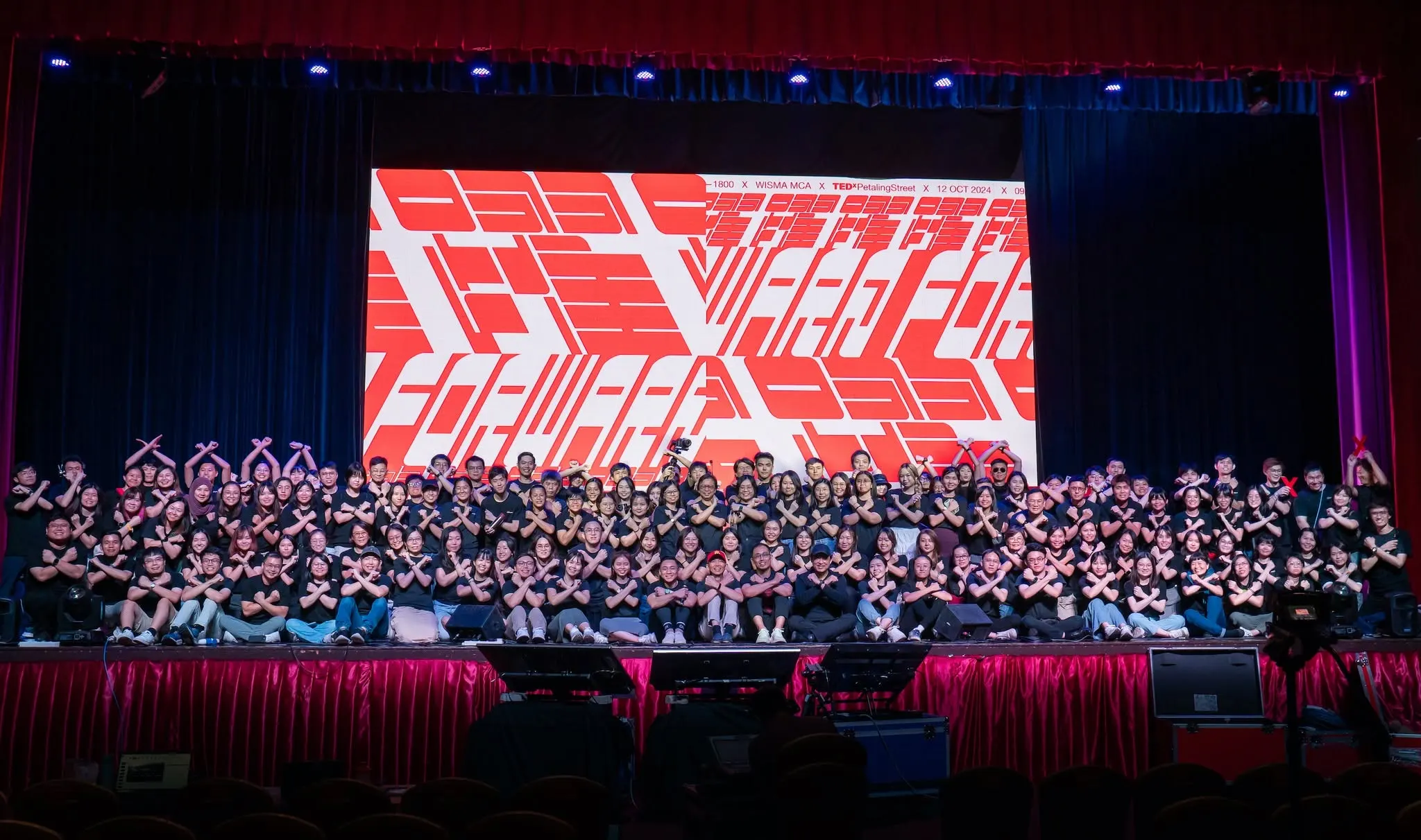 Organisers and volunteers on stage at TEDxPetalingStreet 2024 at Wisma MCA on 12 October 2024